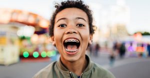 a happy boy shows his new braces kl that done from Tiew Dental Malaysia